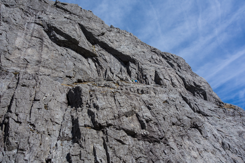 The monolithic South Wall of Garbh Bheinn with climbers just about to start up Excalibur