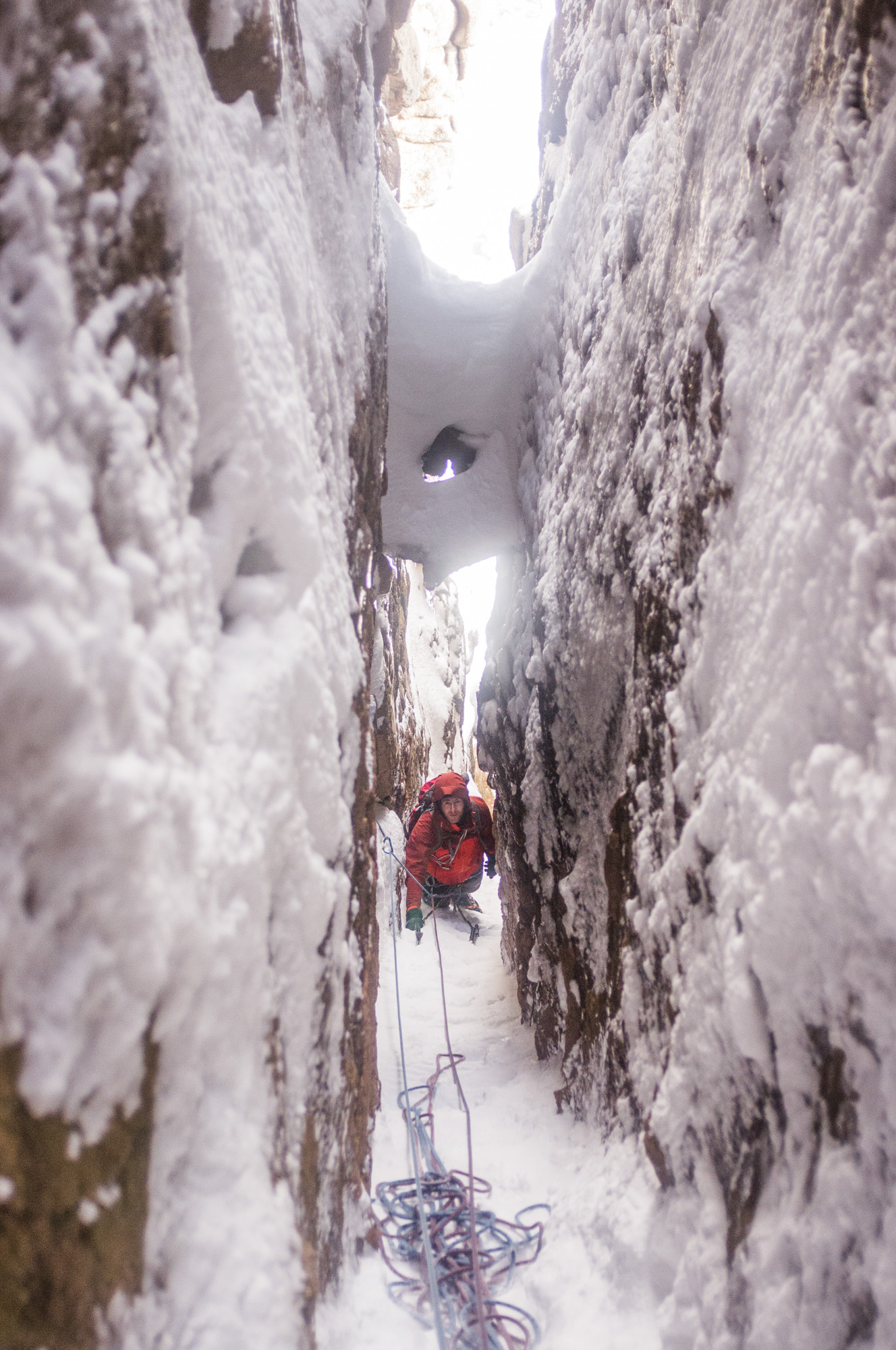 Going deeper underground amidst amazing scenery at the end of the third pitch. Photo credit: Andy Harrison