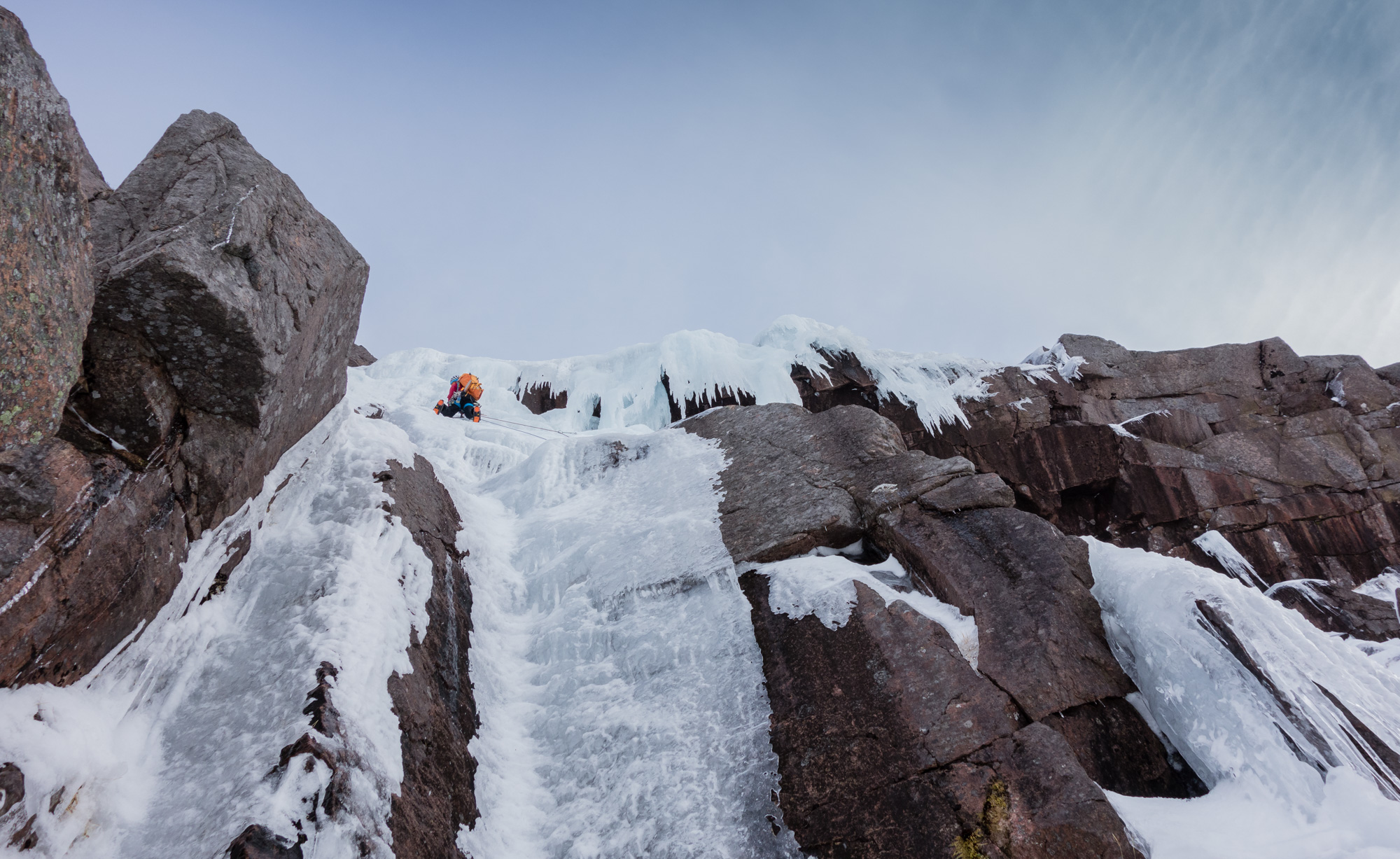 Andy approaching the final steepening after a rising traverse on slightly worrying ice. Photo credit: Joe Dobson