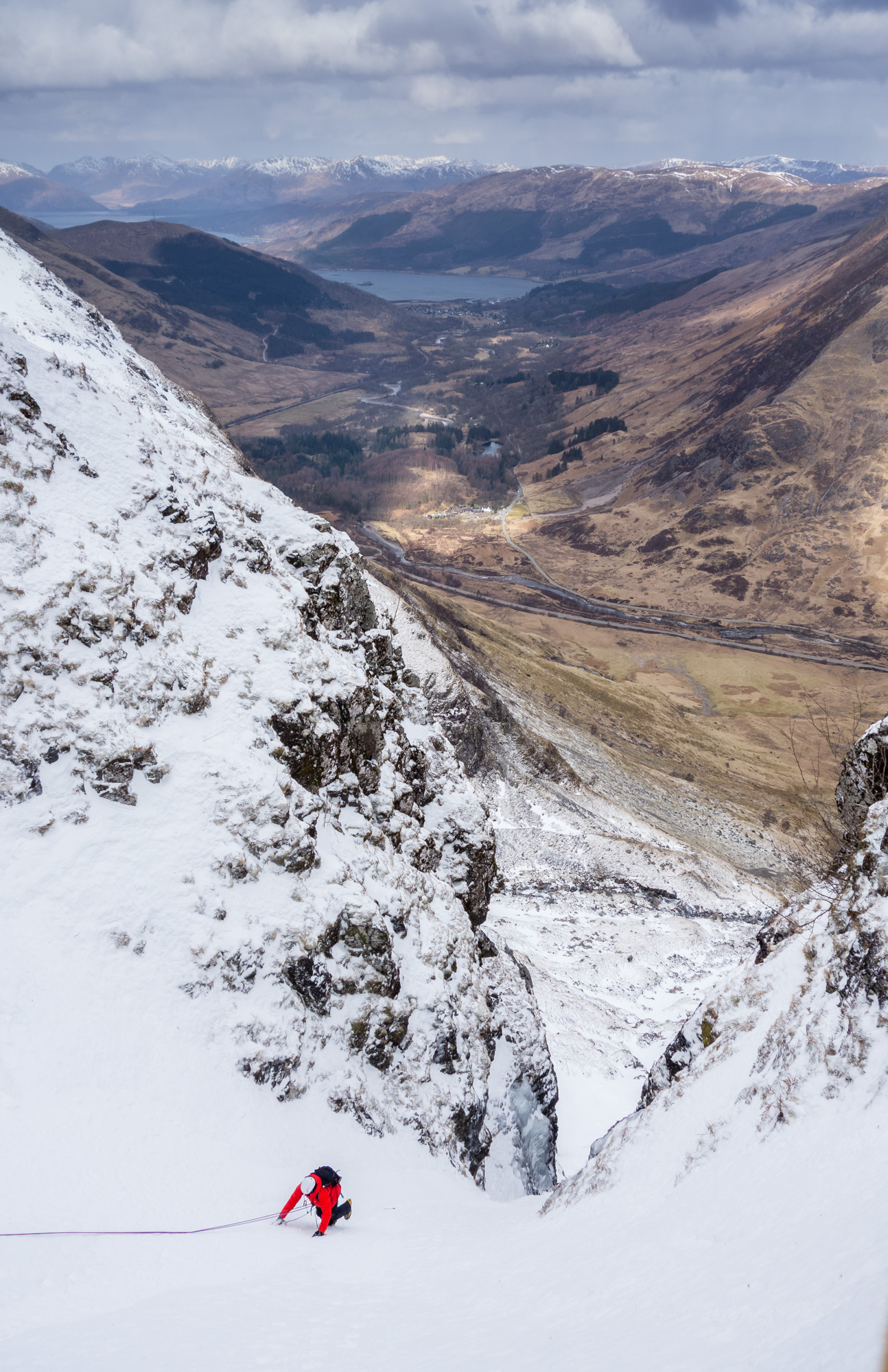 The team behind us finishing the second pitch with amazing views to Loch Leven and beyond. Photo credit: Ric Hines