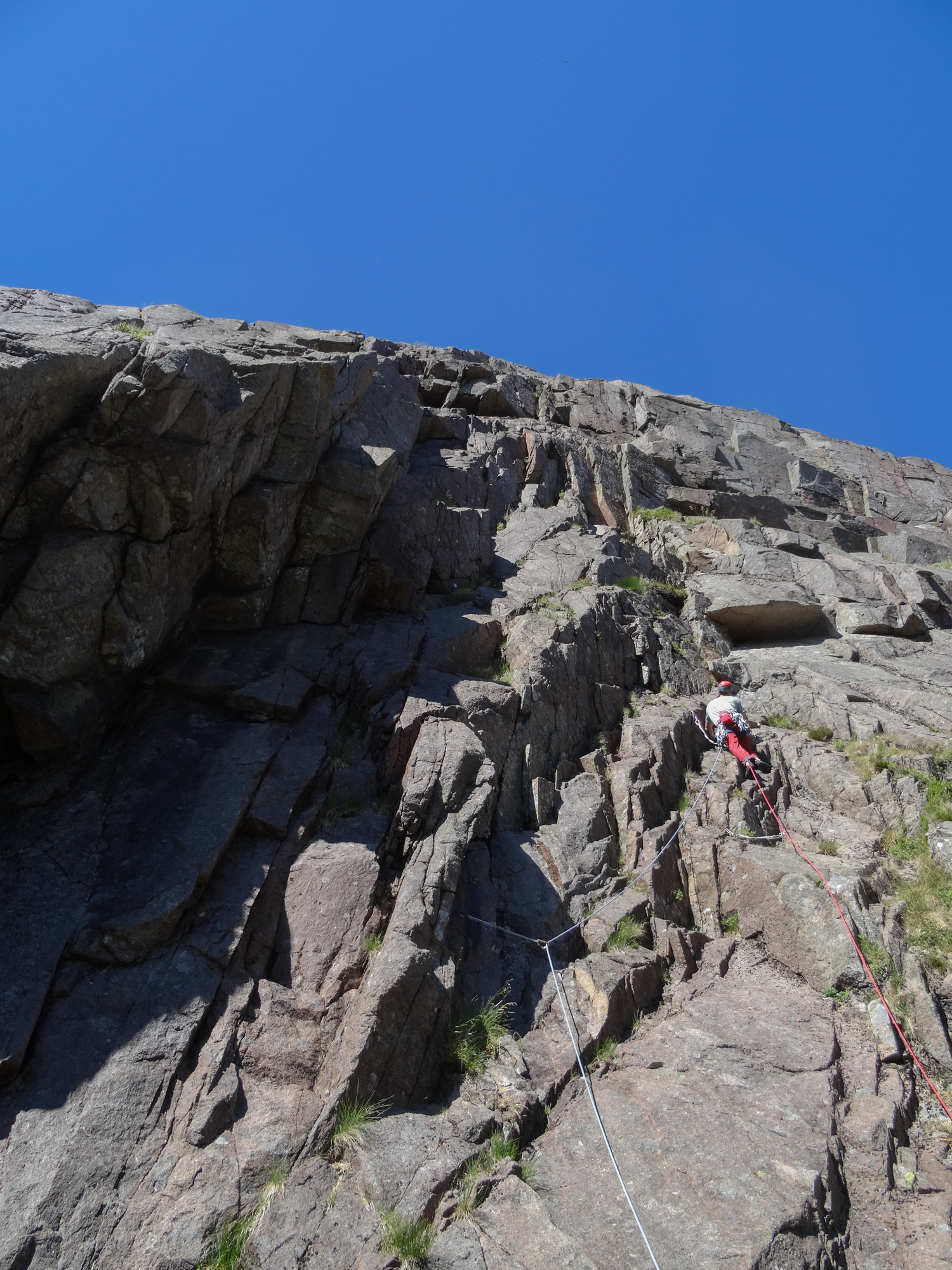 Stepping off the ground and immediately off-route. One of these days I'll read the guide properly! The correct route follows the sun-shadow line up the cracked groove, before heading left across ledges to the slab above. Photo credit: Callum Johnson