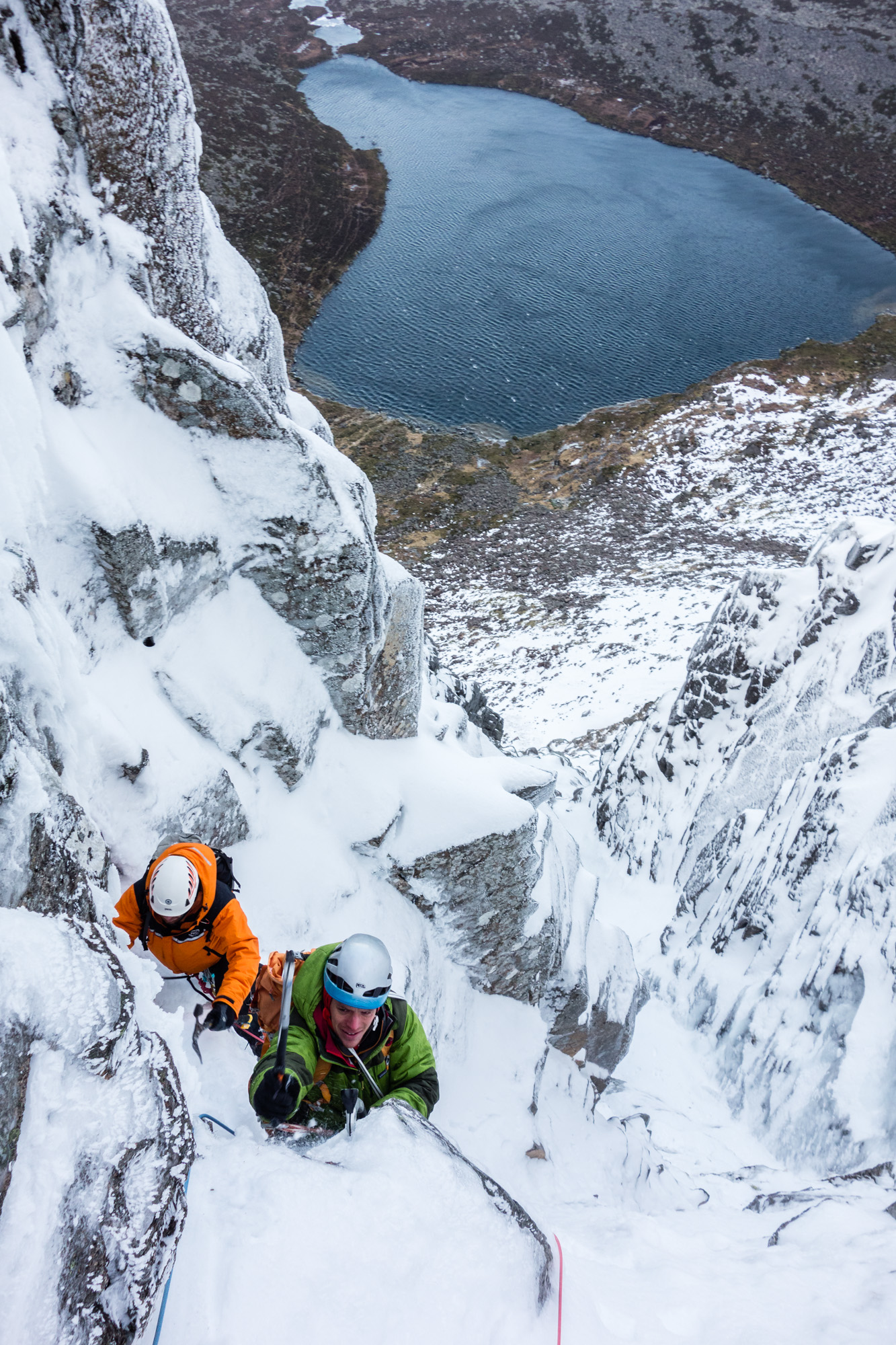 The top of the difficulties on pitch 5, where an exposed move left around the projecting block gains the easier angled gully above